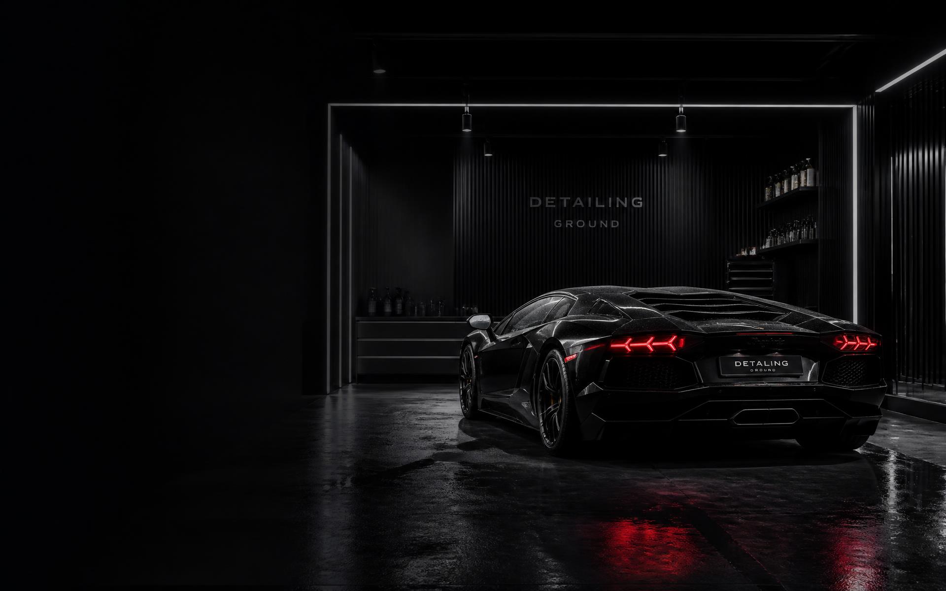 Estudio de detailing profesional con un vehículo premium bajo iluminación cinematográfica